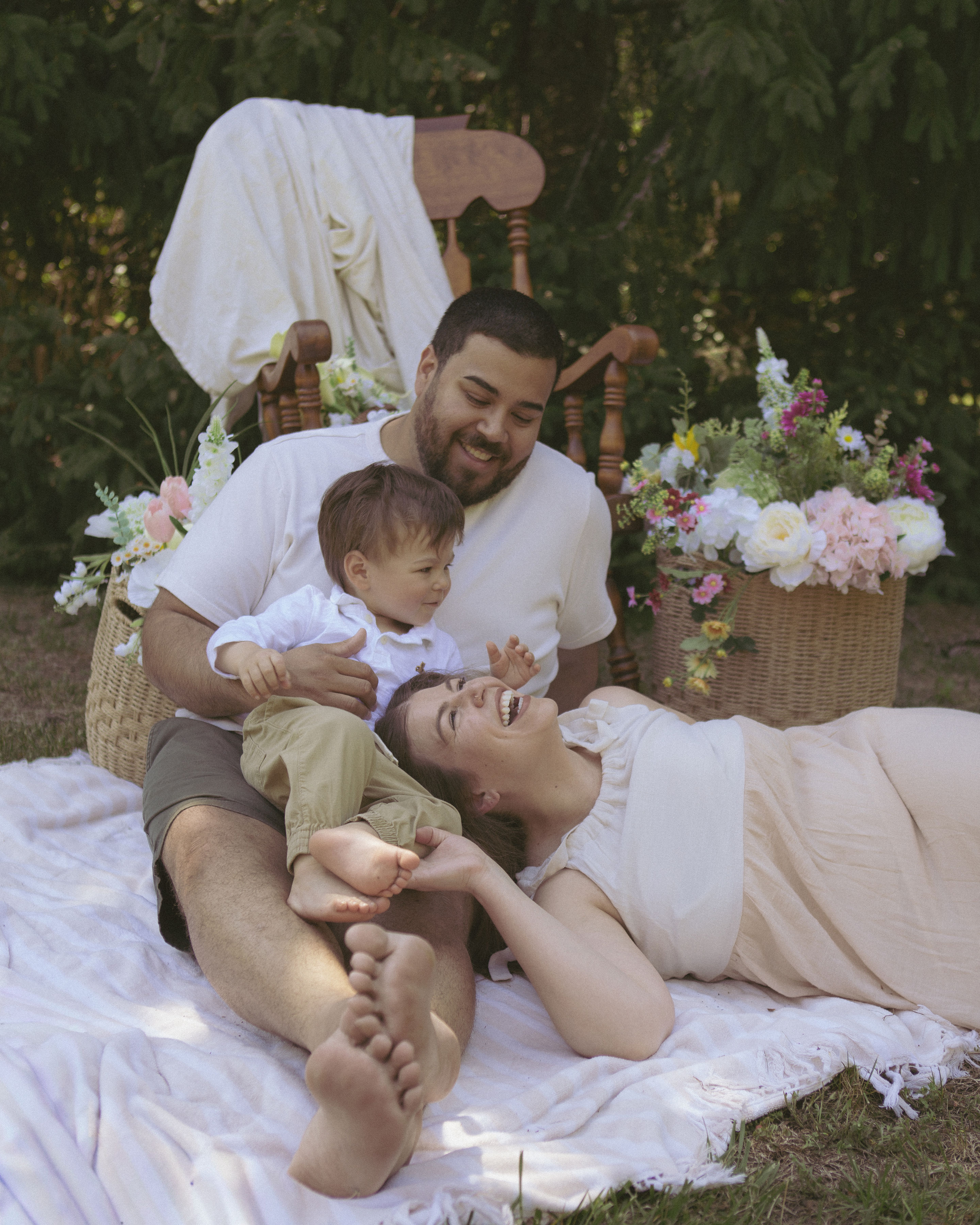 Family on a picnic blanket setup at Root & Rise